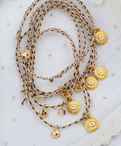 Γήινα neutral βραχιόλια μαρτυρικά με χρυσά charms και ματάκια - πλεγμένα κορδόνια χονδρική βάπτισης