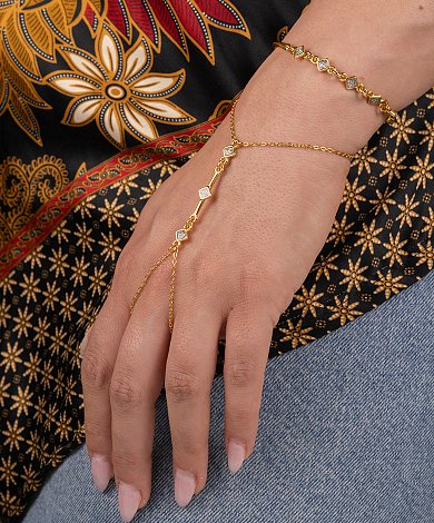 Wholesale gold hand chain jewelry with delicate charms and two-loop connectors for wrist-to-finger designs