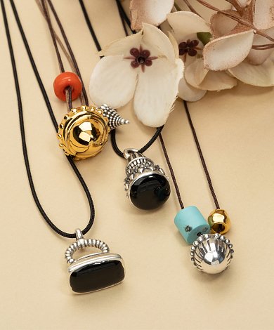 unique ethnic inspired charms with detailed surfaces and enamel accents, gold or silver plated zamak