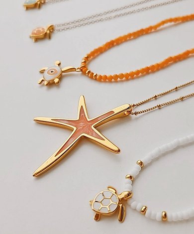 Gold plated zamak starfish pendant with peach enamel on chain necklace, sea life charms and beaded bracelet, wholesale summer jewelry components